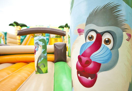 Buy jungle world themed inflatable mega slide with 3D obstacles for kids. Order inflatable slides now online at JB Inflatables UK