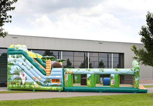 Buy an inflatable extra wide slide in the jungle world theme with 3D obstacles for children. Order inflatable slides now online at JB Inflatables UK