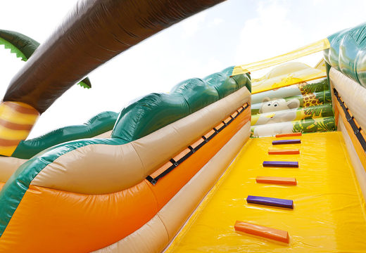Buy large extra wide inflatable Jungle World slide with 3D obstacles for kids. Order inflatable slides now online at JB Inflatables UK