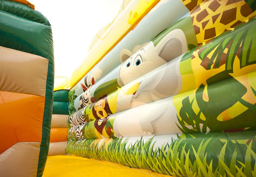 Order inflatable mega slide in jungle world theme with 3D obstacles for kids. Buy inflatable slides now online at JB Inflatables UK