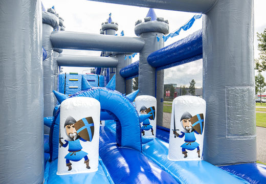 Castle run 17m obstacle course with 7 game elements and colorful objects for kids. Buy inflatable obstacle courses online now at JB Inflatables UK