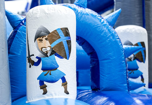 Buy inflatable unique 17 meter wide obstacle course in a castle theme with 7 game elements and colorful objects for children. Order inflatable obstacle courses now online at JB Inflatables UK
