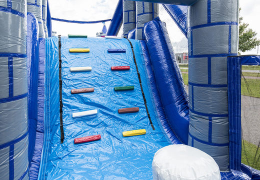 Unique 17 meter wide obstacle course in a castle theme with 7 game elements and colorful objects for kids. Buy inflatable obstacle courses online now at JB Inflatables UK