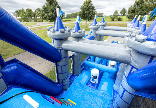 Order an inflatable castle themed obstacle course with 7 game elements and colorful objects for kids. Buy inflatable obstacle courses online now at JB Inflatables UK