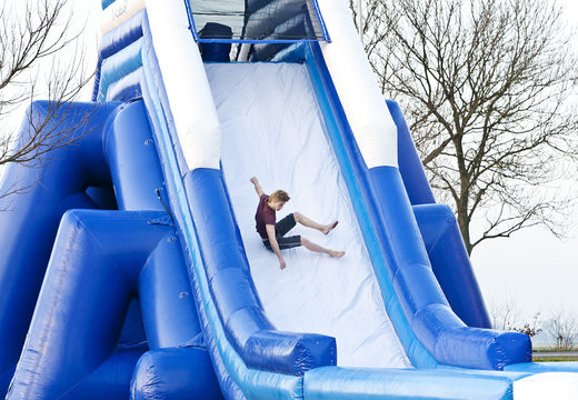 Monster slide 11 meters high and 54 meters long with a double staircase and wide slide. Order inflatable slides now online at JB Inflatables UK
