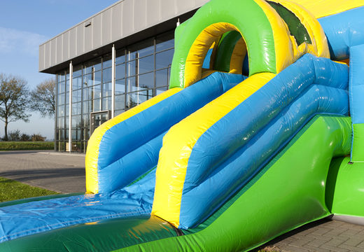 Order an inflatable multifun bouncy castle with roof and slide in football theme for kids with 3D object at the top at JB Inflatables UK. Buy inflatable bouncy castles online at JB Inflatables UK