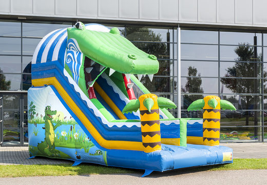 Buy Crocodile slide with the cheerful colors and nice print on the back wall. Order inflatable slides now online at JB Inflatables UK