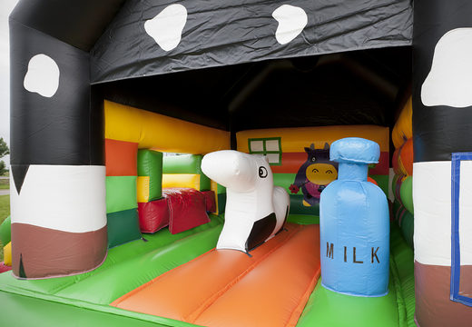 Order multifun cow bounce house with different obstacles, a slide and 3D figure of a cow on the roof for kids. Buy bounce houses online at JB Inflatables UK
