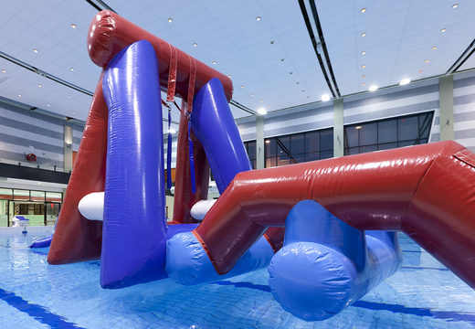 Inflatable Water obstacle run assault course with two climbing walls, a balancing object, a pendulum tower and a slide for both young and old to buy. Order inflatable pool obstacle courses now online at JB Inflatables UK