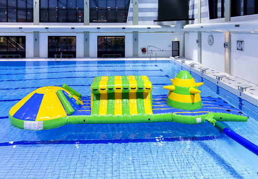 Unique inflatable adventure run green/blue 10m swimming pool with challenging obstacle objects and round slide for both young and old. Buy inflatable water attractions online now at JB Inflatables UK