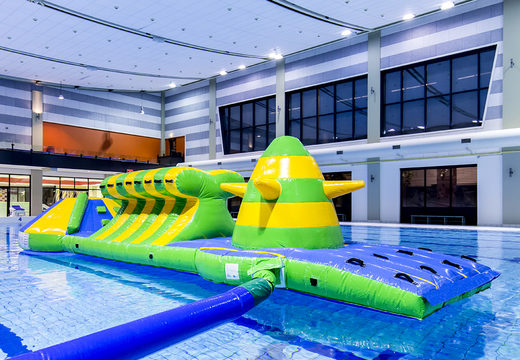 Spectacular inflatable adventure run green/blue 10m swimming pool with challenging obstacle objects and round slide for both young and old. Buy inflatable water attractions online now at JB Inflatables UK