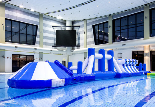 Adventure run blue/white 16m inflatable swimming pool with challenging obstacle objects and round slide for both young and old. Order inflatable pool games now online at JB Inflatables UK