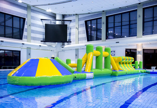 Order unique inflatable adventure run green/blue 16m swimming pool with challenging obstacle objects and round slide for both young and old. Buy inflatable water attractions online now at JB Inflatables UK