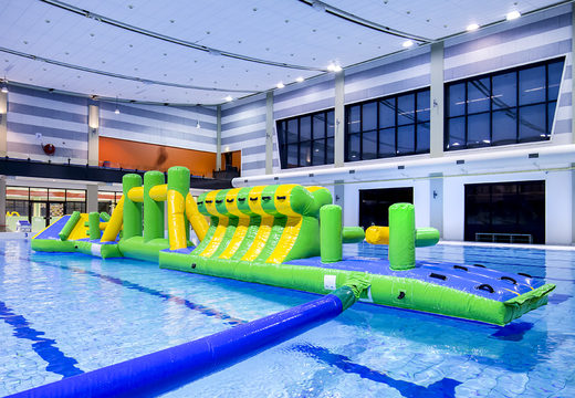 Adventure run green/blue 16m inflatable swimming pool with challenging obstacle objects and round slide for both young and old. Order inflatable pool games now online at JB Inflatables UK