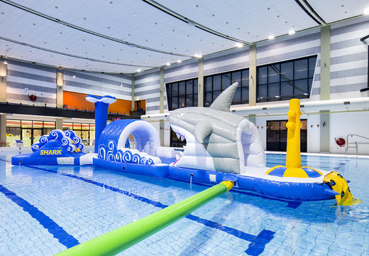 Shark run inflatable 13 meter long obstacle course in a unique design with funny 3D objects and no less than 2 slides for both young and old. Order inflatable pool obstacle courses now online at JB Inflatables UK