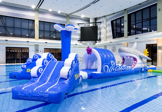 Unique 13 meter long inflatable obstacle course in shark run theme in unique design with funny 3D objects and no less than 2 slides for both young and old. Order inflatable pool games now online at JB Inflatables UK