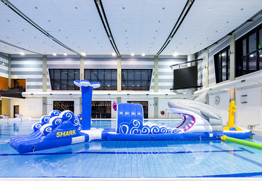 Get an airtight 13 meter long inflatable shark themed swimming pool obstacle course in a unique design with funny 3D objects and no less than 2 slides for both young and old. Order inflatable obstacle courses online now at JB Inflatables UK