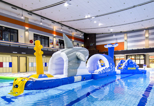 Order a 13-meter long swimming pool obstacle course shark run in a unique design with funny 3D objects and no less than 2 slides for both young and old. Buy inflatable water attractions online now at JB Inflatables UK
