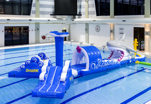 Inflatable 13 meter long shark run swimming pool obstacle course in a unique design with funny 3D objects and no less than 2 slides for both young and old. Order inflatable obstacle courses online now at JB Inflatables UK
