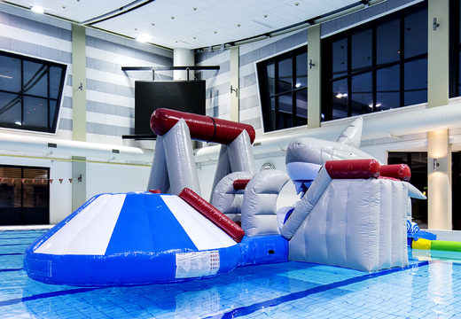 Get an airtight inflatable shark play island with a vine, climbing tower, round slide and obstacles for both young and old. Order inflatable pool games now online at JB Inflatables UK