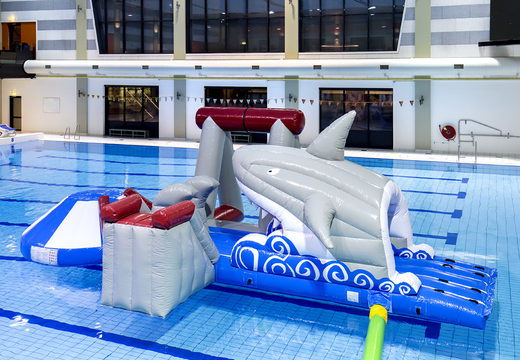 Buy an inflatable airtight shark play island with a vine, climbing tower, round slide and obstacles for both young and old. Order inflatable pool games now online at JB Inflatables UK