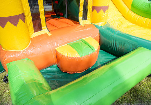 Mini inflatable multiplay bouncer  in jungle theme with slide for children. Order inflatable bouncers online at JB Inflatables UK