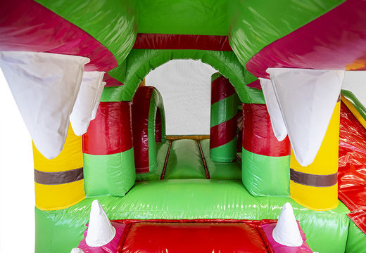 Mini inflatable multiplay bouncy castle in crocodile theme with slide for children. Order inflatable bouncy castles online at JB Inflatables UK