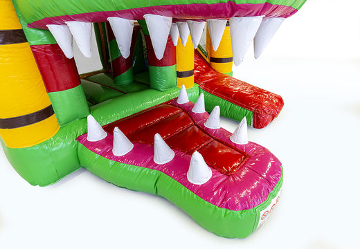 Buy a small inflatable bouncy castle  in a crocodile theme with slide for children. Order inflatable bouncy castles online at JB Inflatables UK