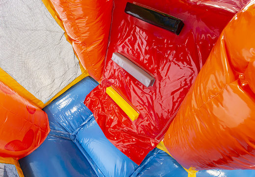 Multiplay party bounce house with a slide, fun objects on the jumping surface and eye-catching 3D objects to buy for children. Order inflatable bounce houses online at JB Inflatables UK