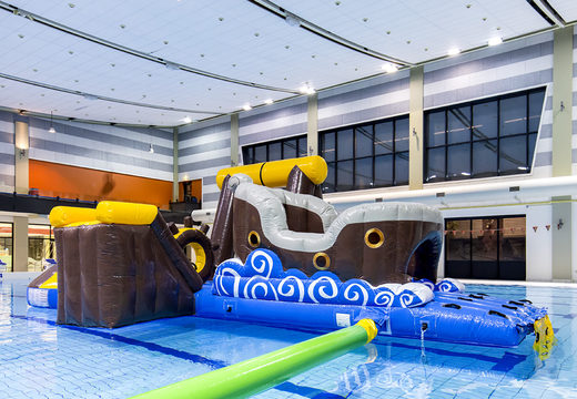 Order an inflatable airtight pirate play island with a vine, climbing tower, round slide and obstacles for both young and old. Buy inflatable water attractions online now at JB Inflatables UK