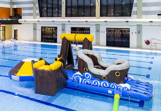 Buy an airtight pirate inflatable play island with a vine, climbing tower, round slide and obstacles for both young and old. Order inflatable water attractions now online at JB Inflatables UK