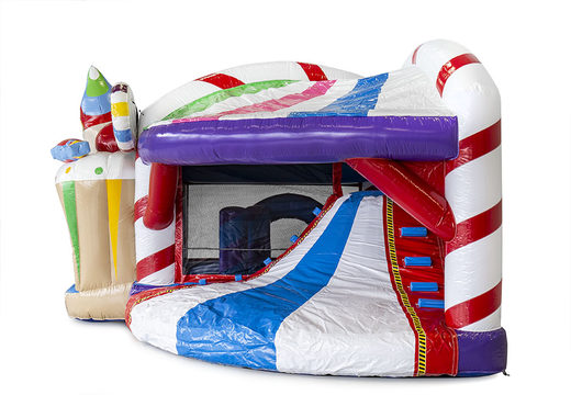 Bouncy castle in candyland theme with a slide for children. Buy inflatable bouncy castles online at JB Inflatables UK