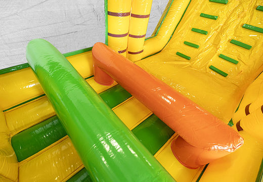 Obstacle course 13.5 meters long in a jungle theme with appropriate 3D objects for children. Order inflatable obstacle courses now online at JB Inflatables UK