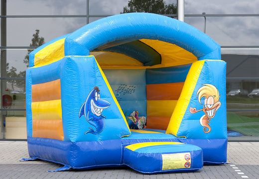 Small bounce house with roof for kids to buy in blue and yellow seaworld theme. Buy bounce houses online at JB Inflatables UK 