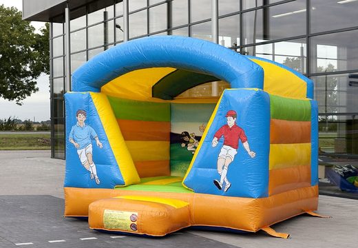 Mini-roofed bouncy castle in a colour combination of blue yellow green and orange in football theme for kids to buy. Order bouncy castles now at JB Inflatables UK  online