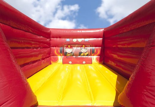 Small mostly red open inflatable bouncer in fire brigade theme for sale. Buy bouncers at JB Inflatables UK online