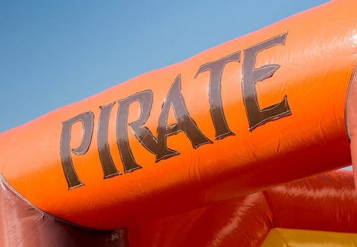 Buy a large Indoor pirate bouncy castle with a slide on the jumping surface, climbing tower and fun obstacles in pirate themed with prints for kids. Order bouncy castles online at JB Inflatables UK.