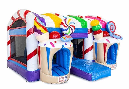 Candyland themed bouncy castle with a slide and 3D objects for children. Order bouncy castles online at JB Inflatables UK