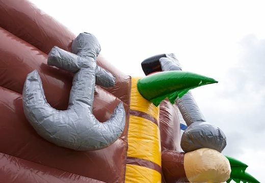 Pirate boat themed bouncy castle with a slide and 3D objects for children. Order bouncy castles online at JB Inflatables UK