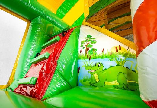 Buy Jungleworld bouncer in a unique design with two entrances, a slide in the middle and 3D objects for kids. Order bouncers online at JB Inflatables UK