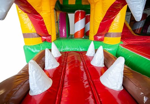 Order inflatable multiplay Jungleworld bounce house with a slide and 3D objects for kids. Buy bounce houses online at JB Inflatables UK