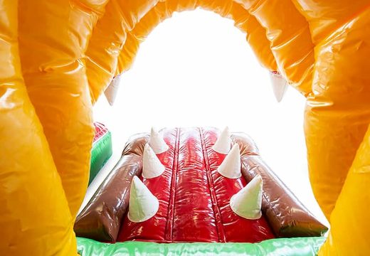 Jungleworld themed bouncy castle with a slide and 3D objects for children. Order bouncy castles online at JB Inflatables UK