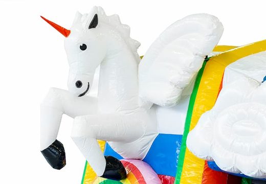 Inflatable multiplay unicorn bouncy castle with a slide in the middle and 3D objects for children. Order bouncy castles online at JB Inflatables UK
