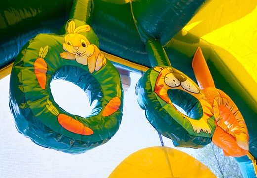 Buy shooting combo jungle bouncer covered with cannon game and slide for kids. Order bouncers online at JB Inflatables UK