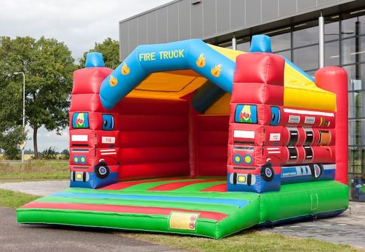 Super bouncy castle with roof in fire department  theme for kids. Buy bouncy castles online at JB Inflatables UK