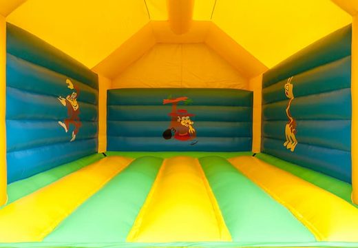 Big super bounce house covered with cheerful animations in giraffe theme for children. Order bounce houses online at JB Inflatables UK