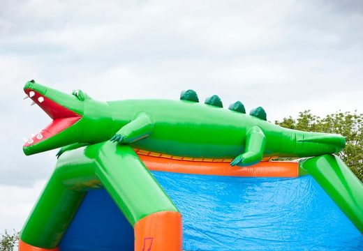 Big inflatable bouncy castle with roof in crocodile theme to buy for kids. Order bouncy castles online at JB Inflatables UK