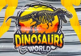 Jurassic World bouncy castle with dinosaur theme.