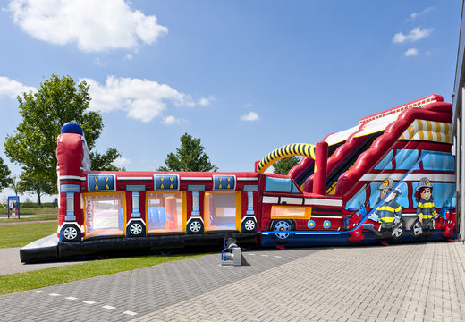Buy an inflatable extra wide slide in the Fire Brigade World theme with 3D obstacles for children. Order inflatable slides now online at JB Inflatables UK
