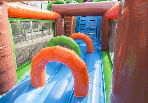 Unique 17 meter wide obstacle course in a crocodile theme with 7 game elements and colorful objects for kids. Buy inflatable obstacle courses online now at JB Inflatables UK